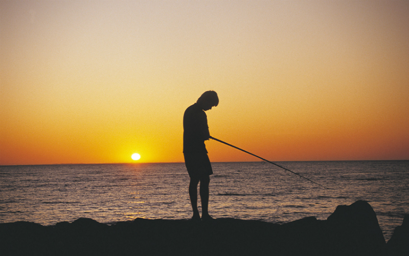 Fishing in Perth, Western Australia at sunset.