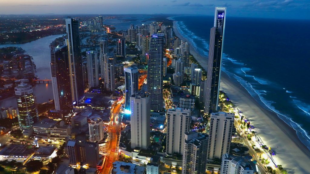 Looking down at the many building and coastline of the Gold Coast from the Skypoint Observation Deck at night.