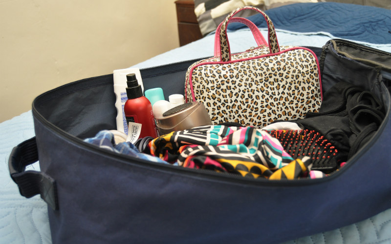 Suitcase packing items belongings