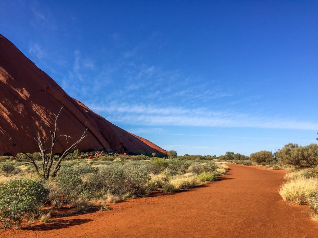 The base of the rock at Uluru in Uluru-Kata Tjuta National Park, Northern Territory, Australia.